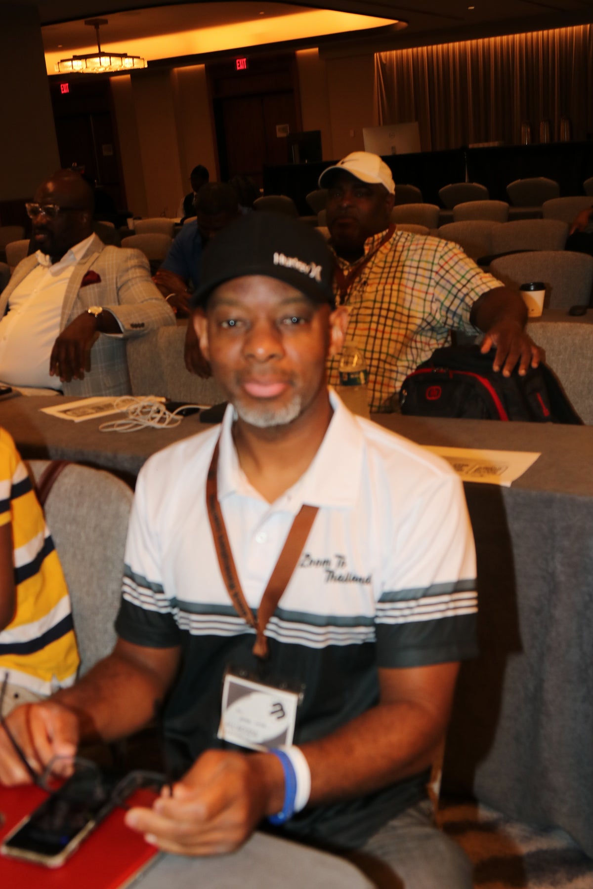 Black Manosphere Conclave attendees laughing and connecting during the event