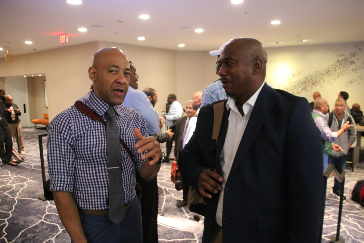 Black Manosphere Conclave attendees networking and talking together