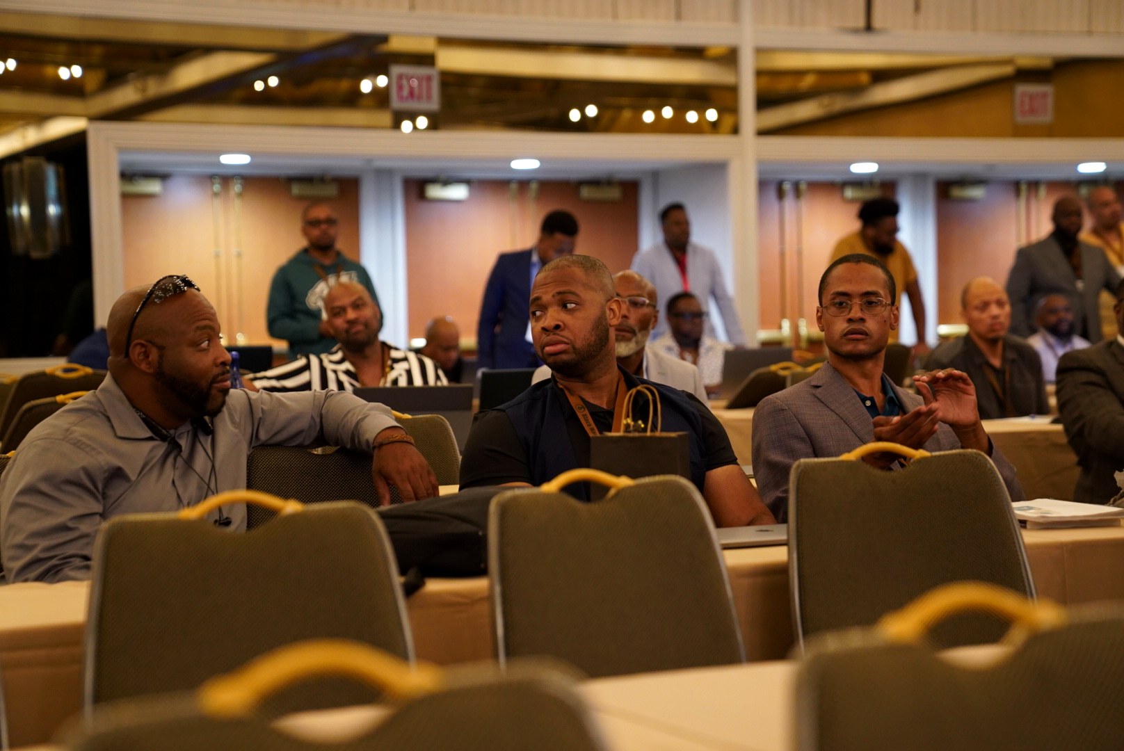 Black Manosphere Conclave attendees in conversation before a session